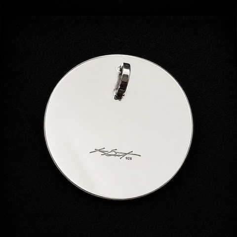 This sterling silver Moon pendant by Kolten Khasalus Grant presents a bold Northwest Coast design in a compact, wearable form back.