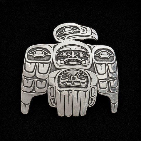 This sterling silver Eagle pendant by Kolten Khasalus Grant presents a bold Northwest Coast design in a compact, wearable form front.