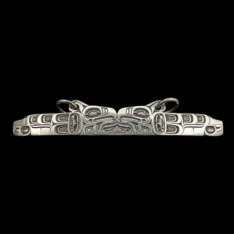 This sterling silver Thunderbird and the Long Life Giver pendant by Kolten Khasalus Grant presents a bold Northwest Coast design in a compact, wearable form front.