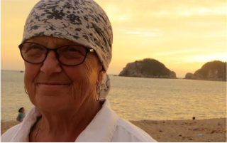 Image of salt spring island artist Bly Kaye with golden sunset and beach in the background