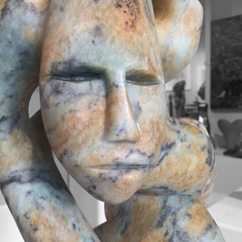 Shaman with Spirit Helpers soap stone carving by abraham ruben close up