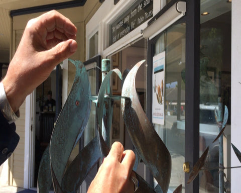 Matt Steffich fixing a cosmetic bend to wind sculpture.