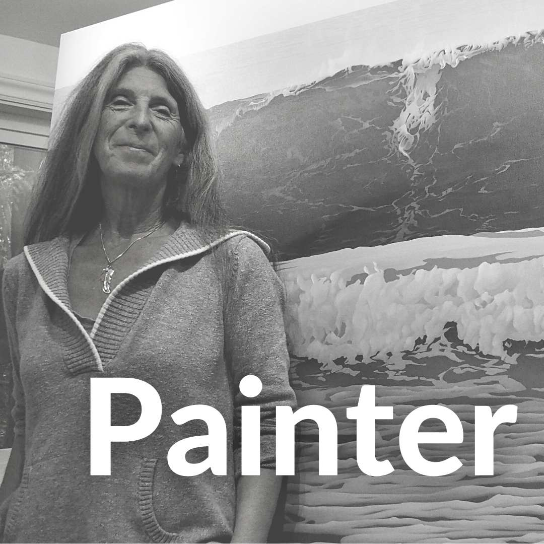 Photo of Carol Haigh Infront of one of her original ocean wave paintings