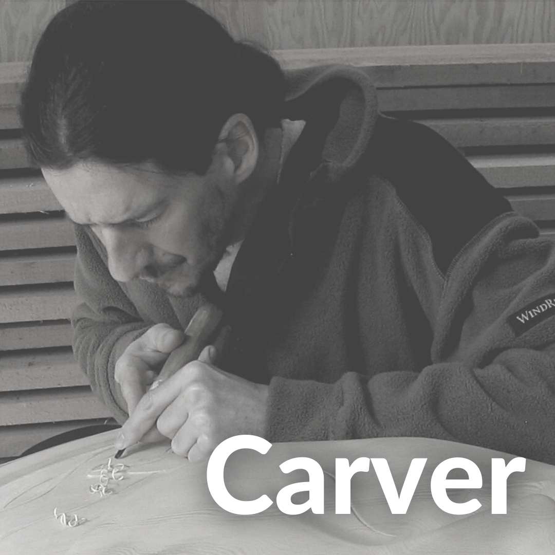 Photo of Richard Menard carving his famous Sun Masks