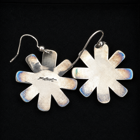 These sterling silver Star Sun earrings by Kolten Khasalus Grant bring a strong Northwest Coast design into an intimate, wearable scale back.