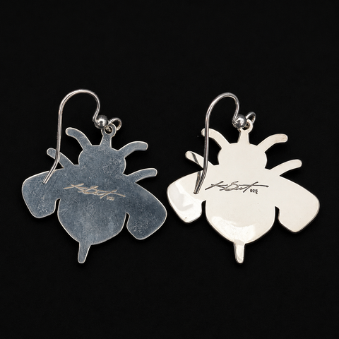 These sterling silver Bumble Bee earrings by Kolten Khasalus Grant bring a strong Northwest Coast design into an intimate, wearable scale back.