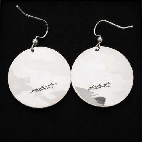 Frog moon silver earrings by artist kolten khasalus grant back.