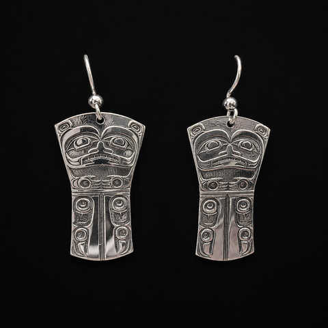 This Grizzly Bear Clan silver earrings by Kolten Khasalus Grant features a finely carved Northwest Coast design in a compact wearable sculptural format. 