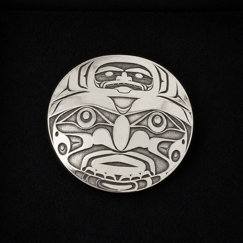 This sterling silver Moon pendant by Kolten Khasalus Grant presents a bold Northwest Coast design in a compact, wearable form front.