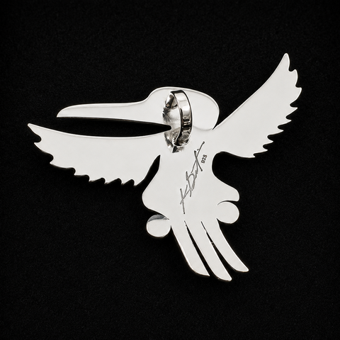 This sterling silver Hummingbird pendant by Kolten Khasalus Grant presents a bold Northwest Coast design in a compact, wearable form back.