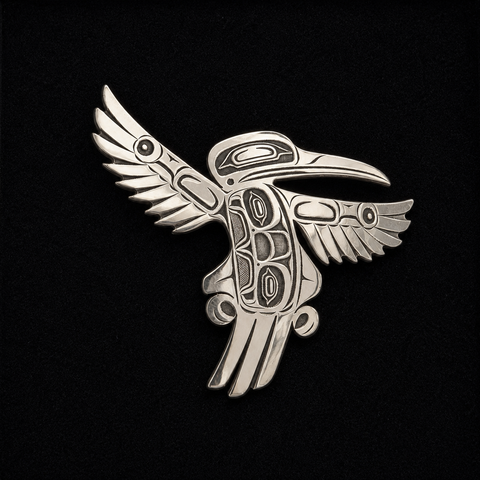 This sterling silver Hummingbird pendant by Kolten Khasalus Grant presents a bold Northwest Coast design in a compact, wearable form front.