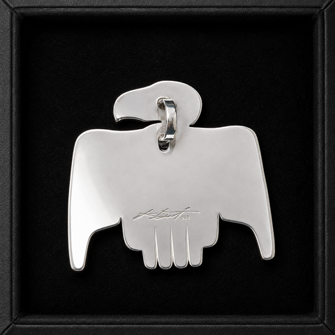 This sterling silver Eagle pendant by Kolten Khasalus Grant presents a bold Northwest Coast design in a compact, wearable form back.
