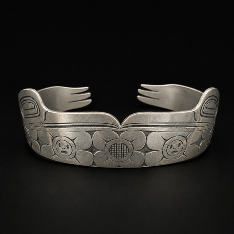 This sterling silver Hummingbird and the Flower People cuff bracelet by Kolten Khasalus Grant carries a flowing Northwest Coast design across a substantial wearable form front.