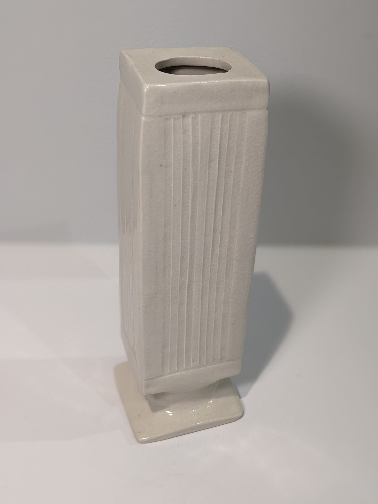 White Vase on Pedestal