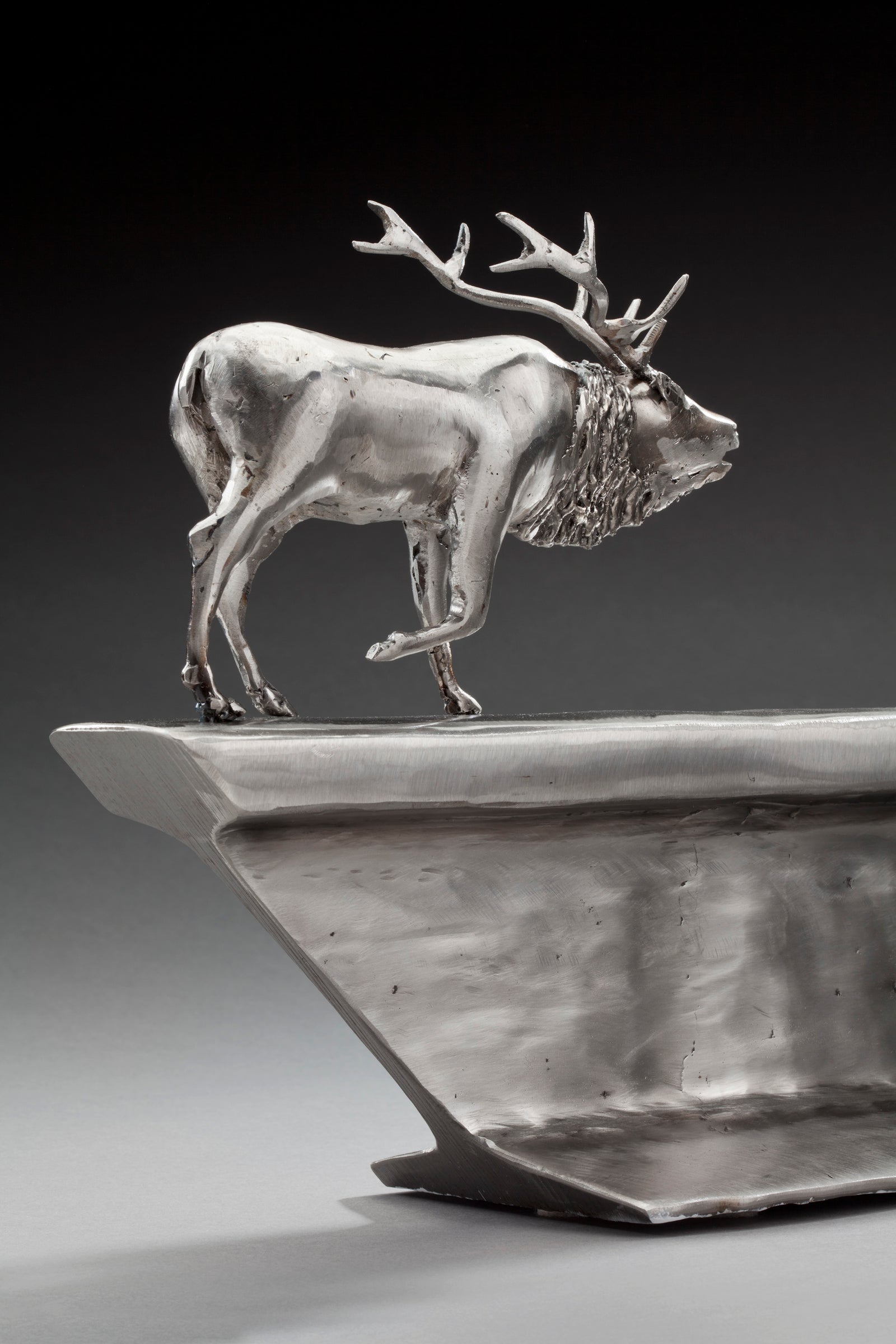 Peter McFarlane Reused Scrap Metal Sculpture with Elk Walking on Old Train Rail