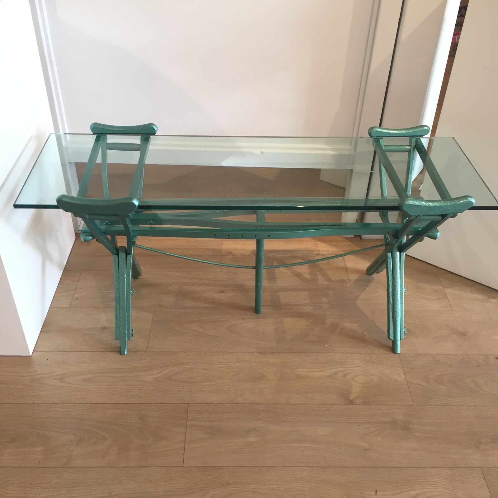 Peter McFarlane Reused Materials A Glass Table made of old wooden crutches painted emerald green