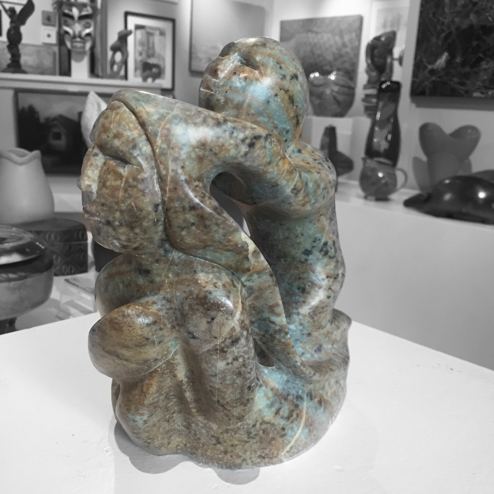 soapstone sculpture of sedna with shaman by master sculptor abraham ruben side view