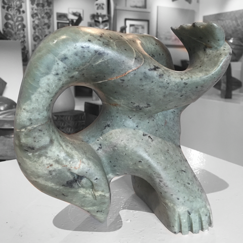 master soap stone carving of seals playing by abraham ruben back view